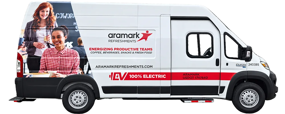 Side view of a white Aramark Refreshments electric delivery van with branded graphics.