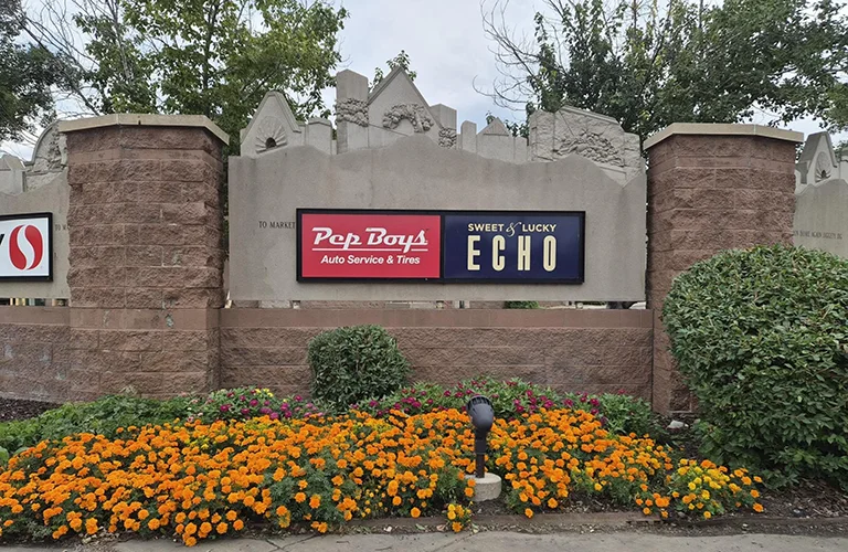 Illuminated commercial monument sign featuring Pep Boys Auto Service & Tires.