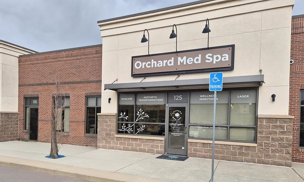 Exterior business sign for Orchard Med Spa mounted above the storefront.