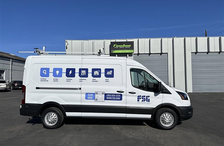 Truck and van graphics on a white commercial service van featuring company logos, service icons, contact information, and a QR code.
